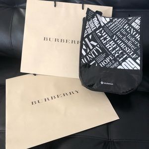 2 Burberry and 1 Lululemon shopping bags